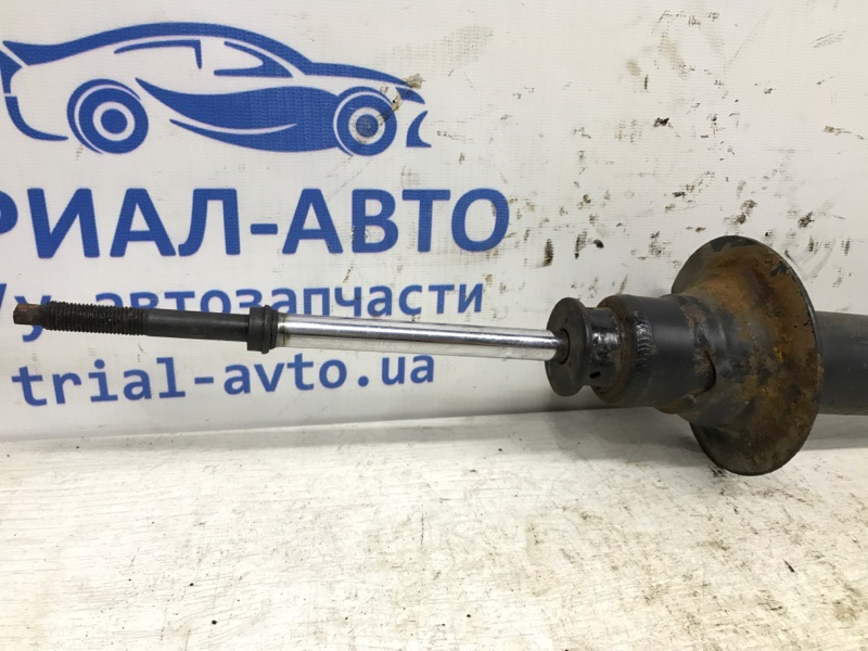 Амортизатор передний левый Mitsubishi L200 KB 2.5 дизель 4D56U МКПП