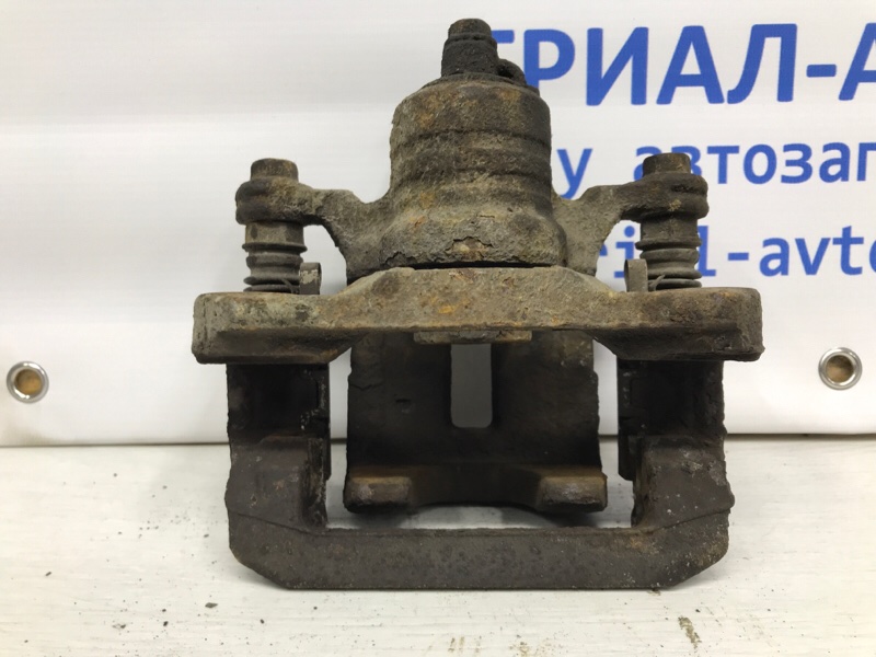 Суппорт задний левый Pathfinder 2004-2014 R51 2.5 Diesel YD25DDTI