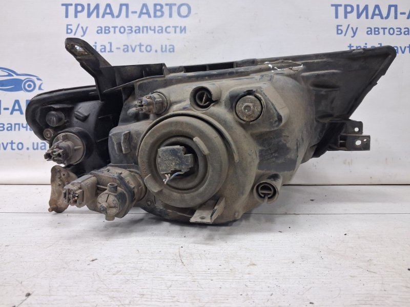 Фара левая галоген L200 2006-2015 KB 2.5 Diesel 4D56