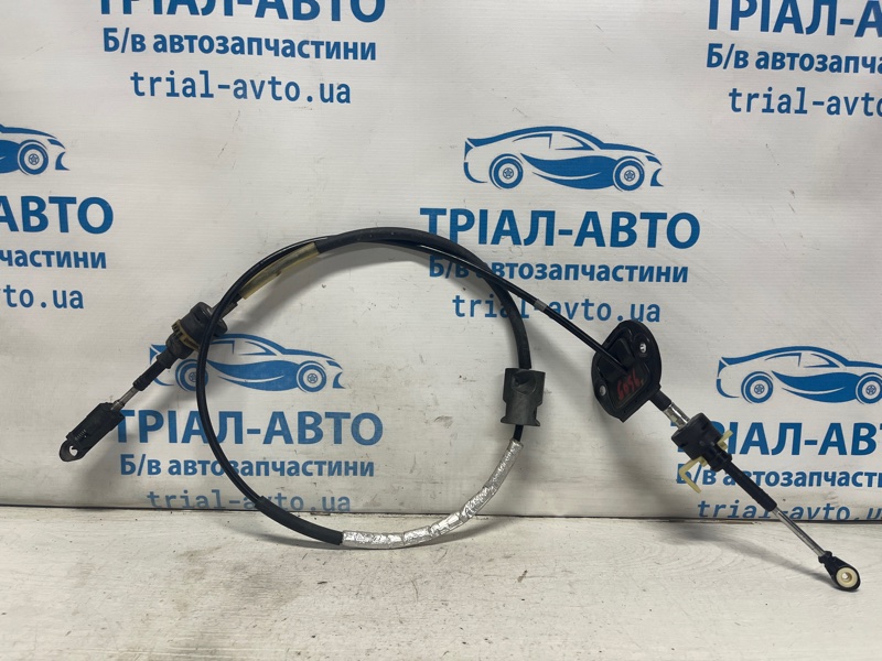 Запчасть трос коробки передач Ford Fusion USA 2013-2020 2 1.5 бензин ENUN0 DG9Z7E395L Б/У Трос коробки передач Ford Fusion USA 2013-2020 2 1.5 бензин ENUN0 DG9Z7E395L Б/У
